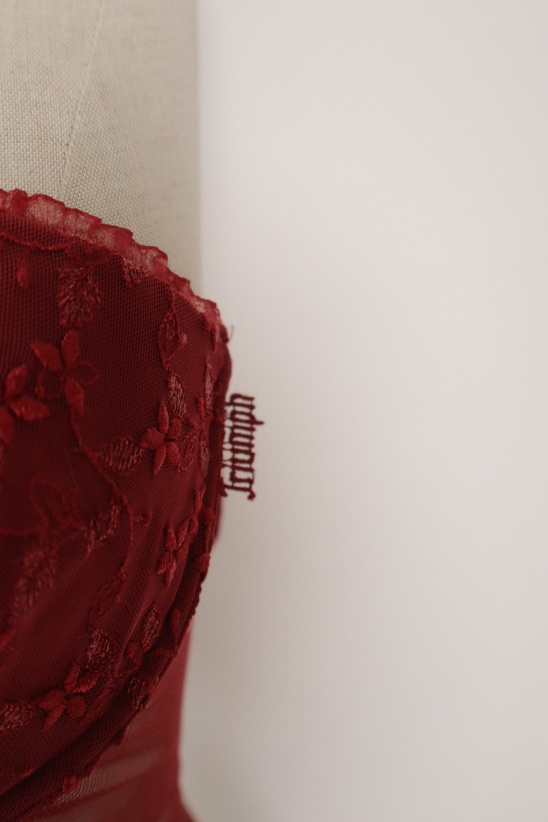 Red Triumph bustier with lace details and see trough back size