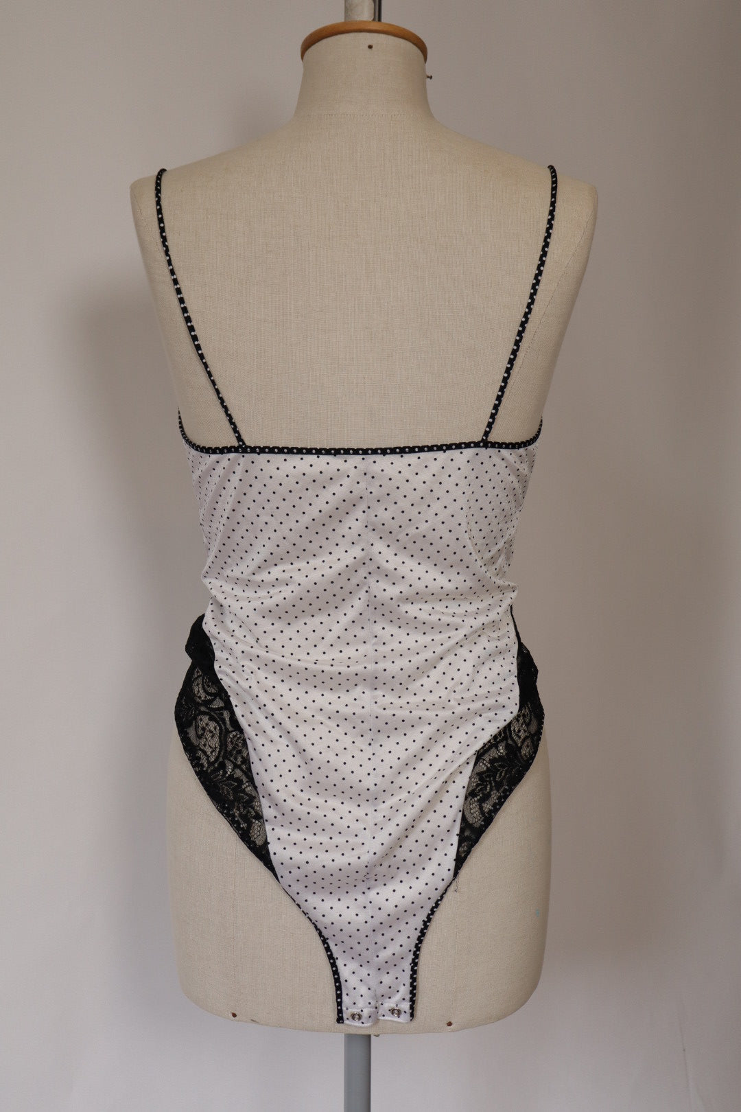 White body with black lace and polka dots size Large