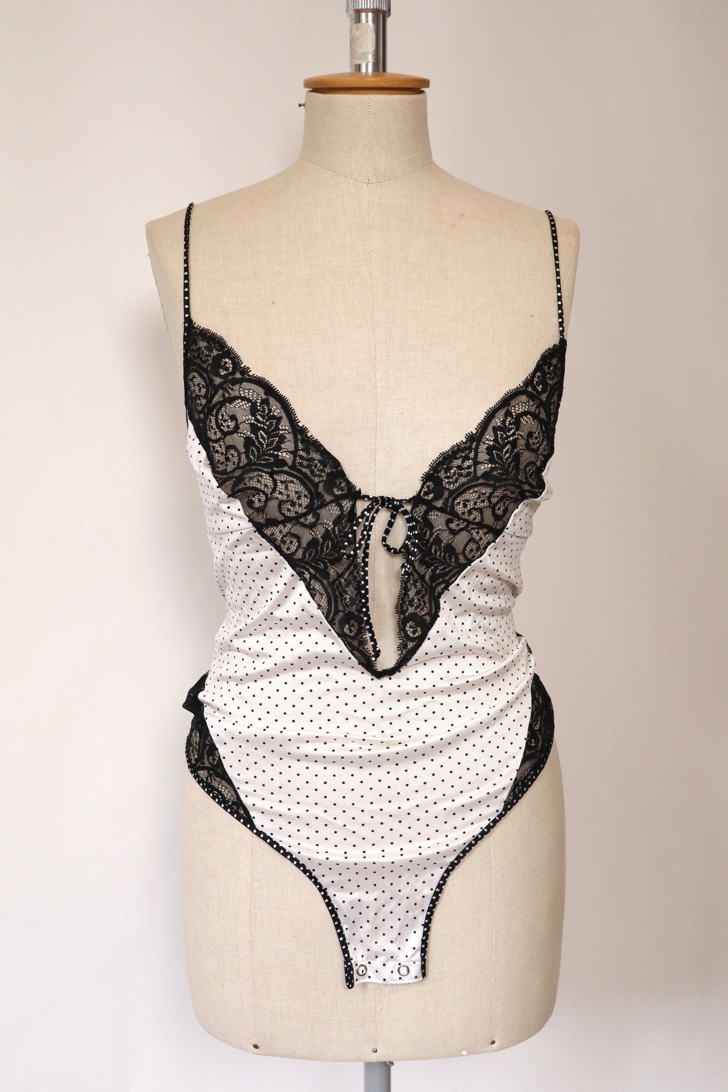 White body with black lace and polka dots size Large