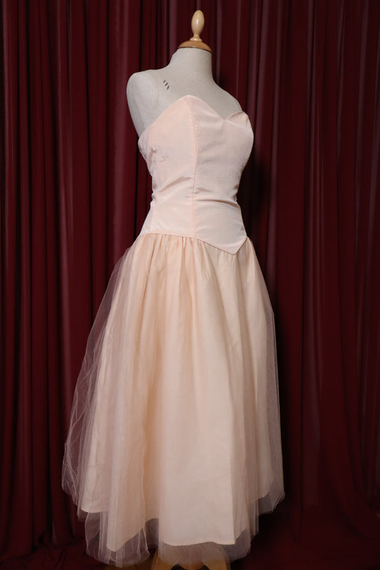1955’s soft pink prom dress with basque waistline, size M