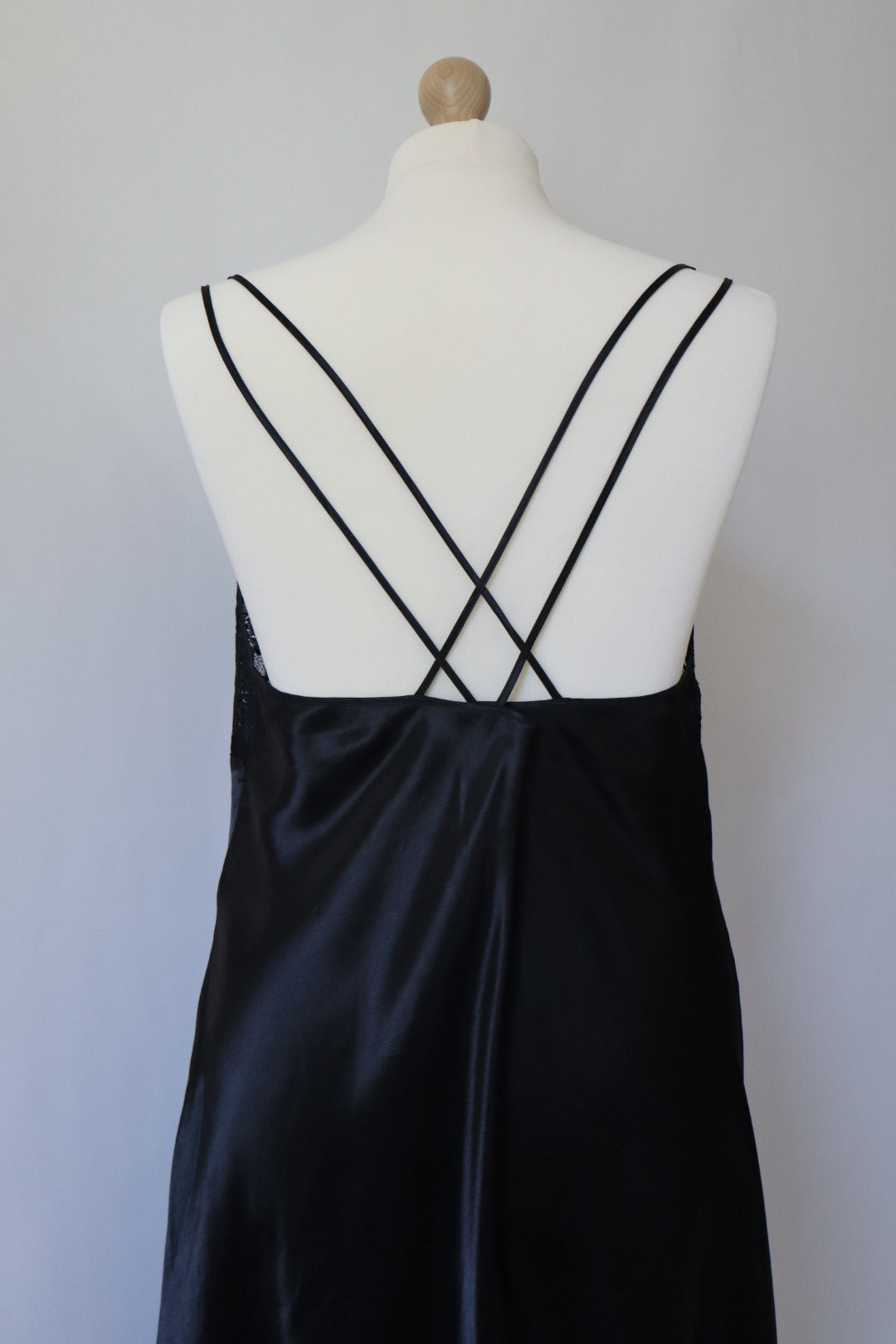 Black 1990’s slipdress with lace details and crossed straps in the back size XXXL