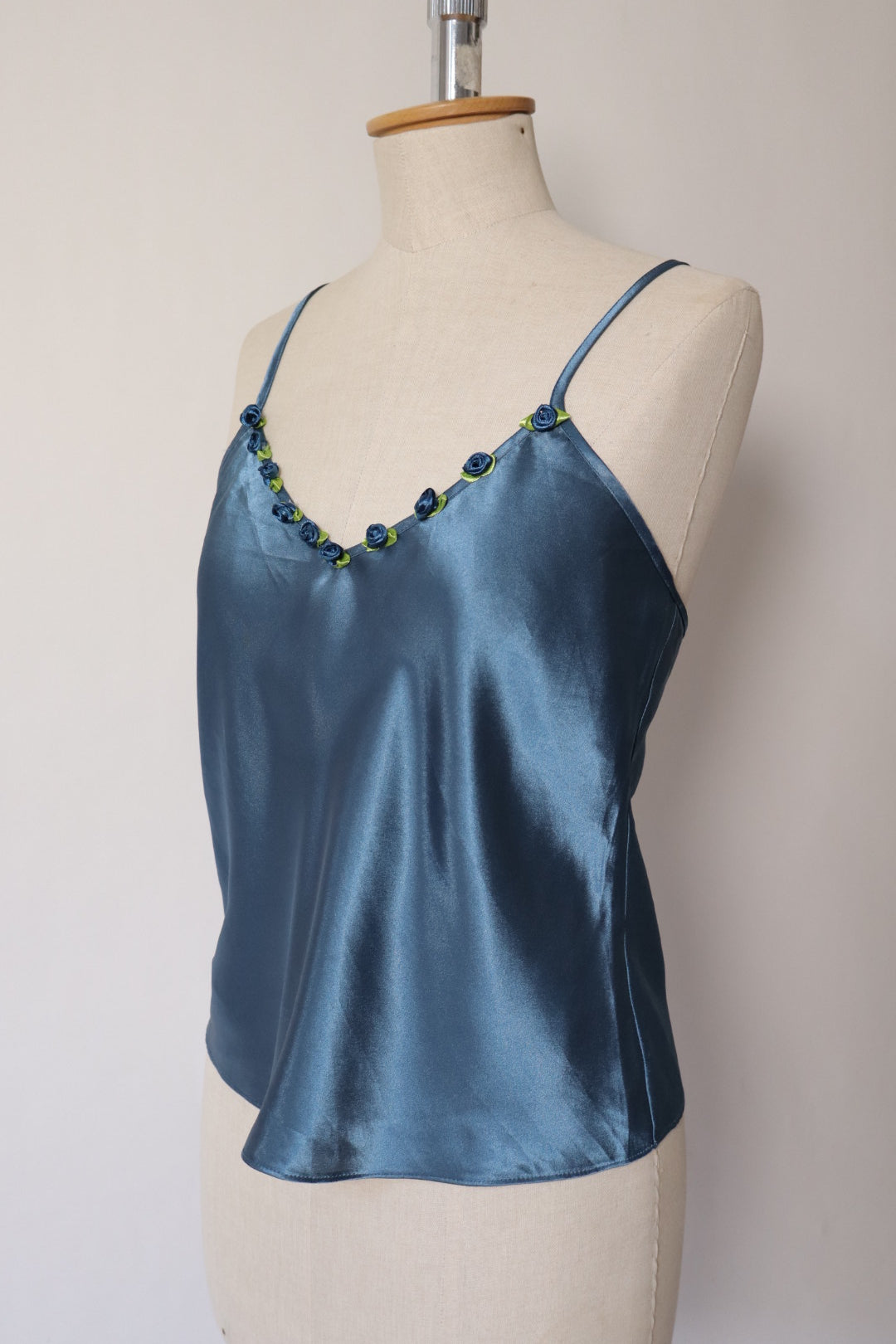 Satin blue cami top with little roses on the neckline size M