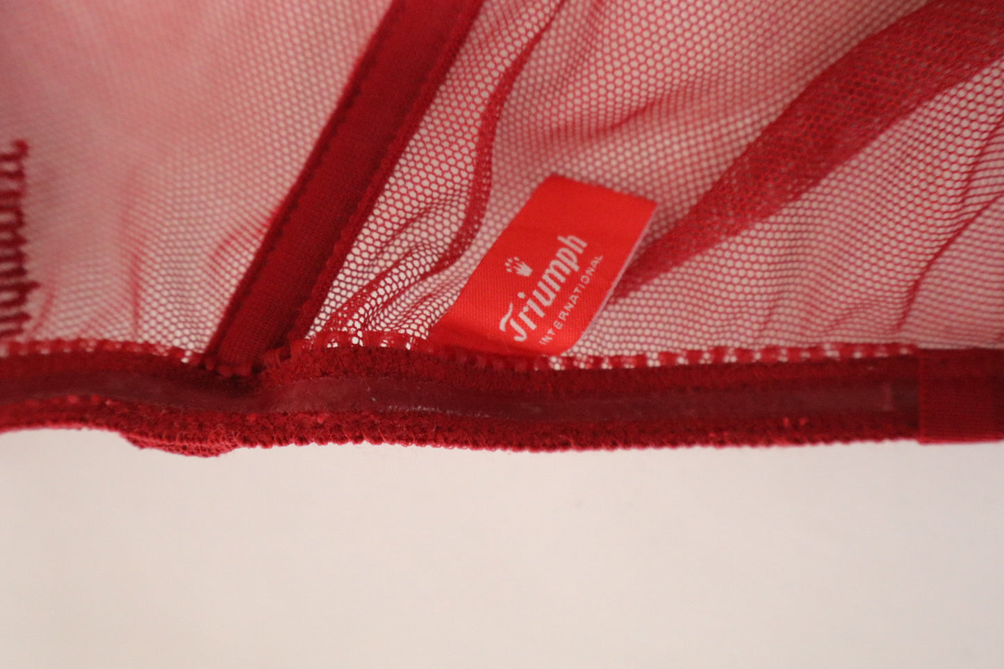 Red Triumph bustier with lace details and see trough back size