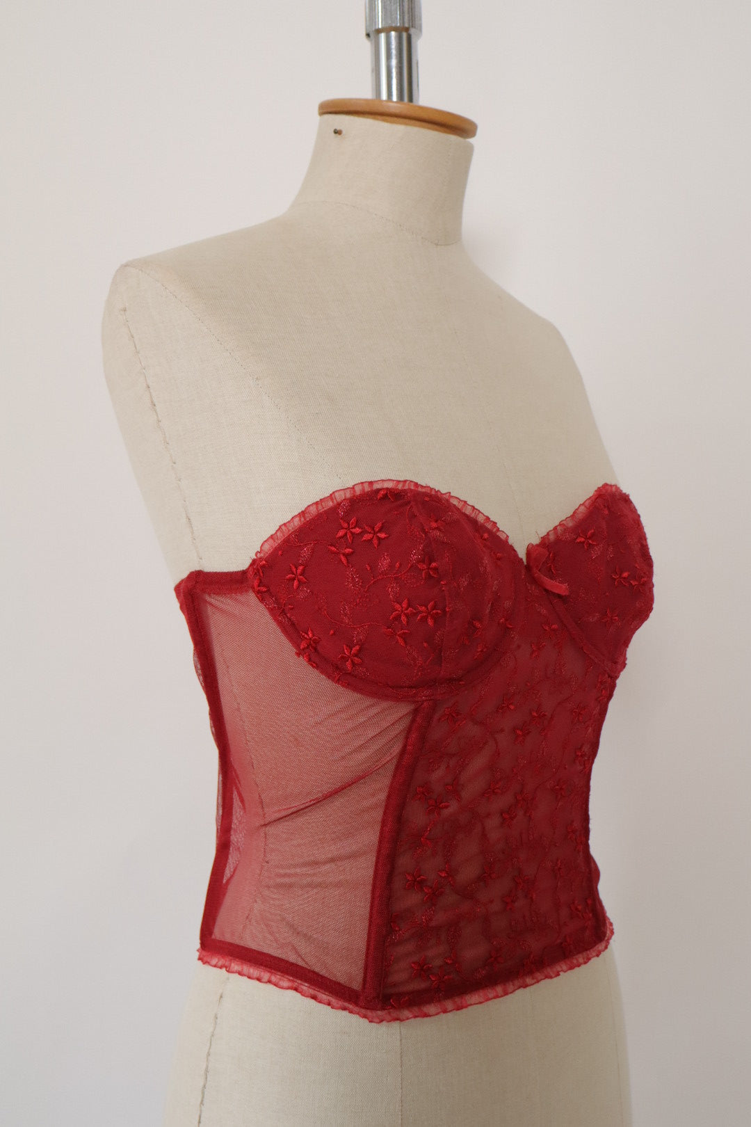 Red Triumph bustier with lace details and see trough back size