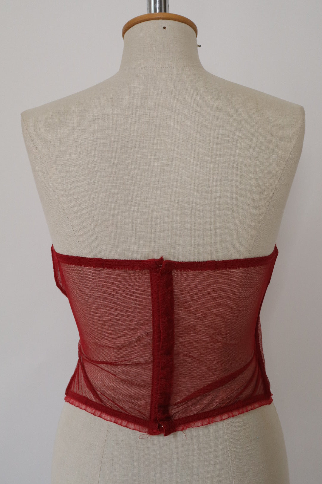 Red Triumph bustier with lace details and see trough back size