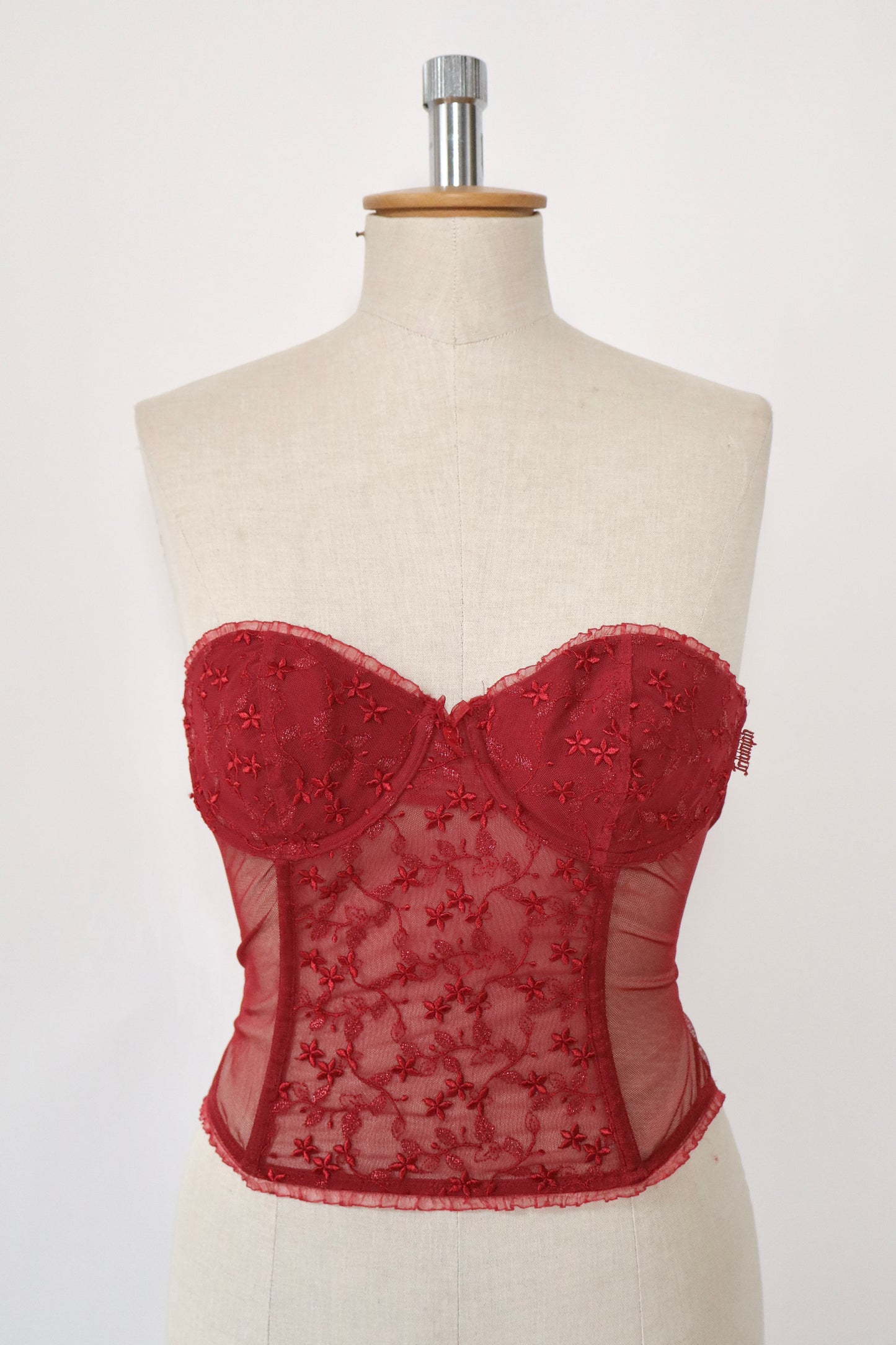 Red Triumph bustier with lace details and see trough back size
