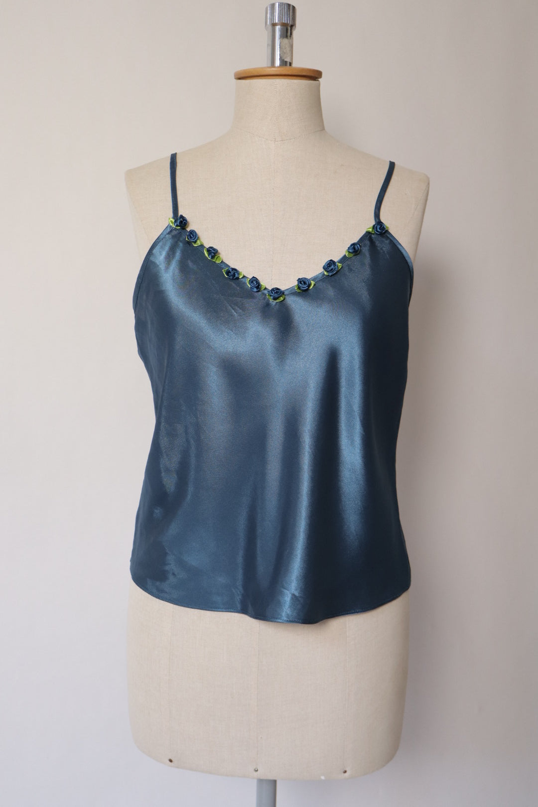 Satin blue cami top with little roses on the neckline size M