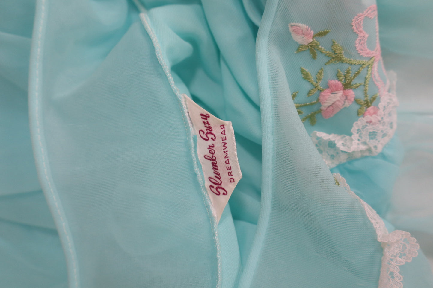 1960’s soft blue babydoll size small with embroidered bow & flower detail