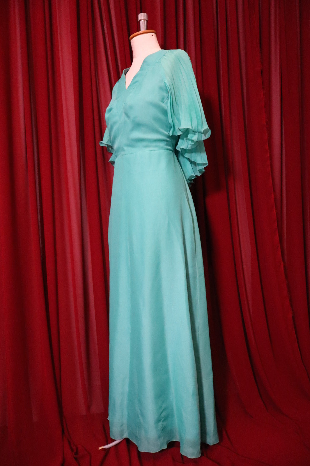 1970’s turquoise long gown with pleaded cape ‘sleeves’ - size L