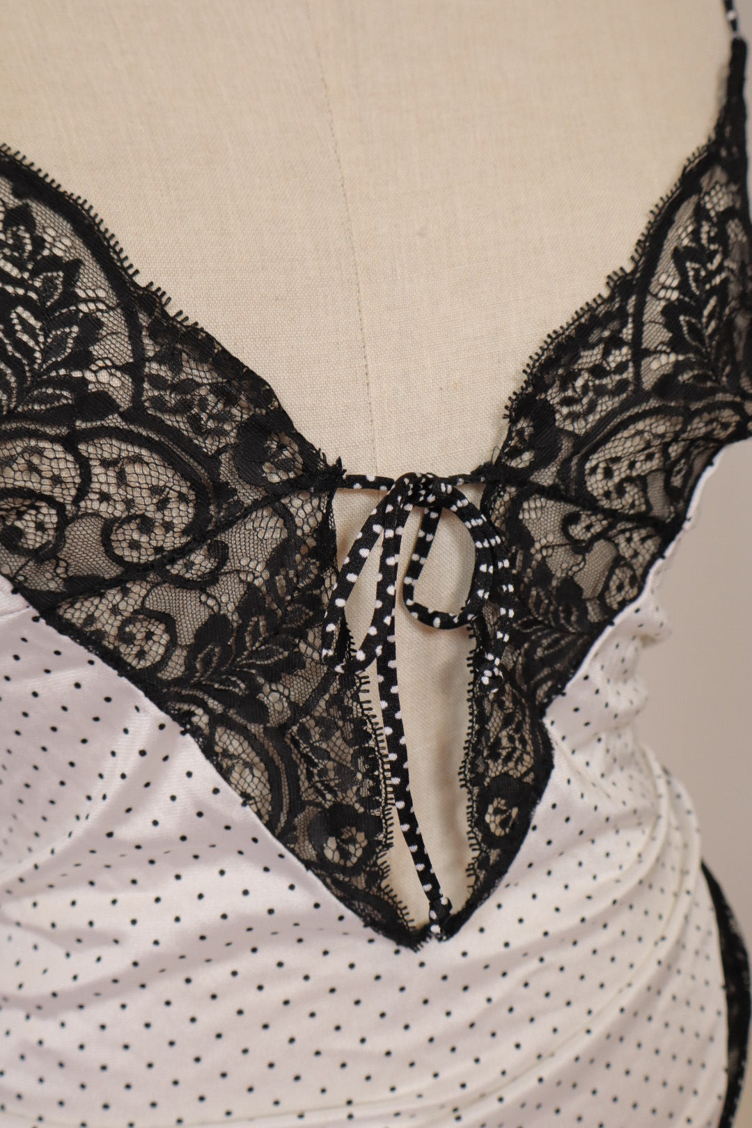 White body with black lace and polka dots size Large