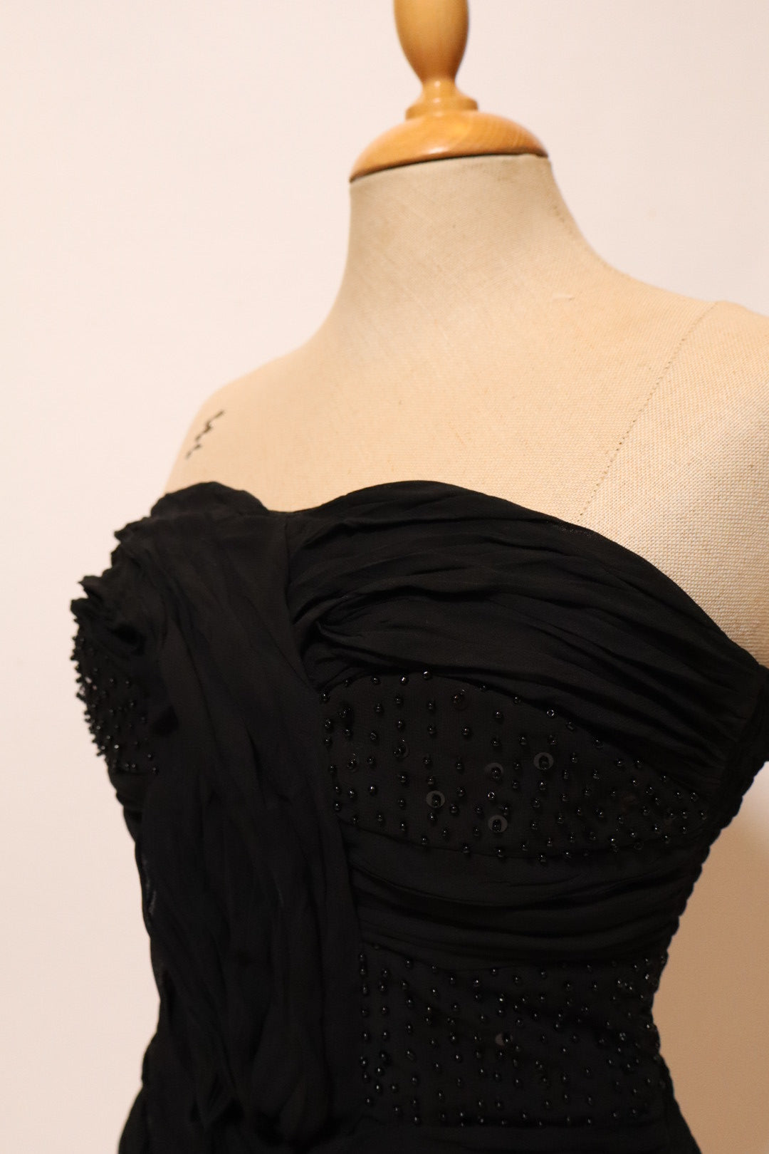 Black bustier top with pleads and beads, size L