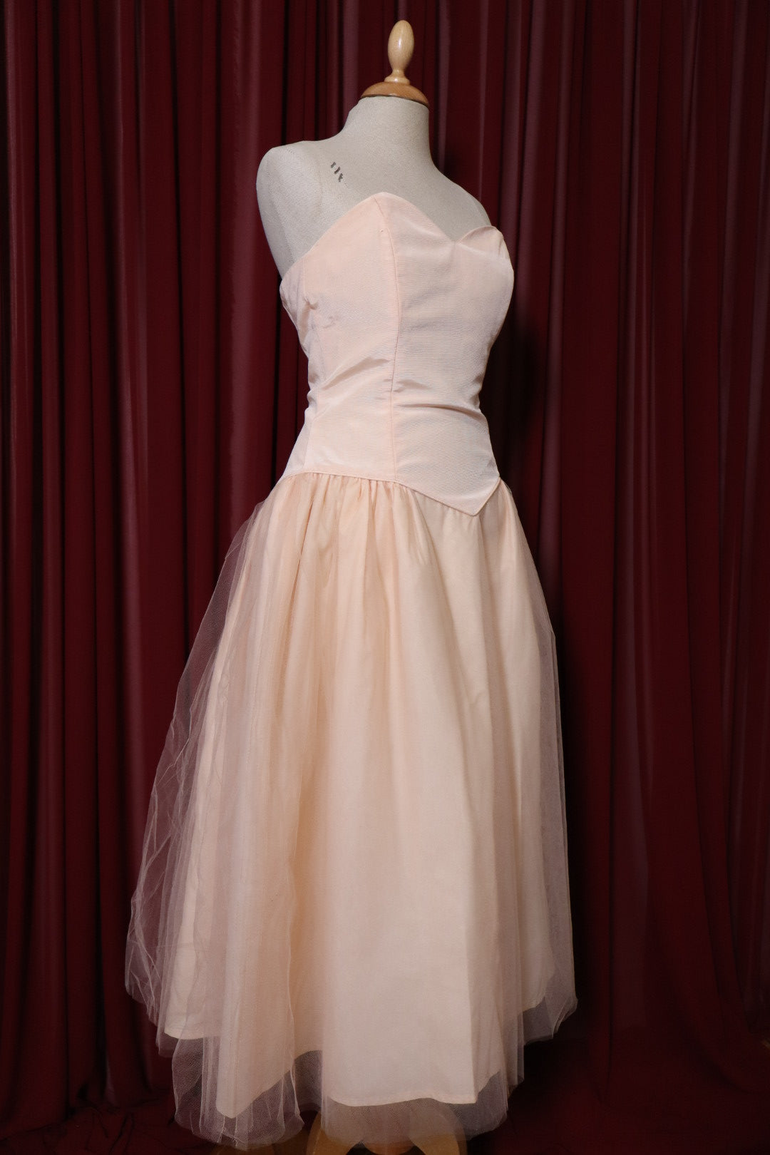 1955’s soft pink prom dress with basque waistline, size M