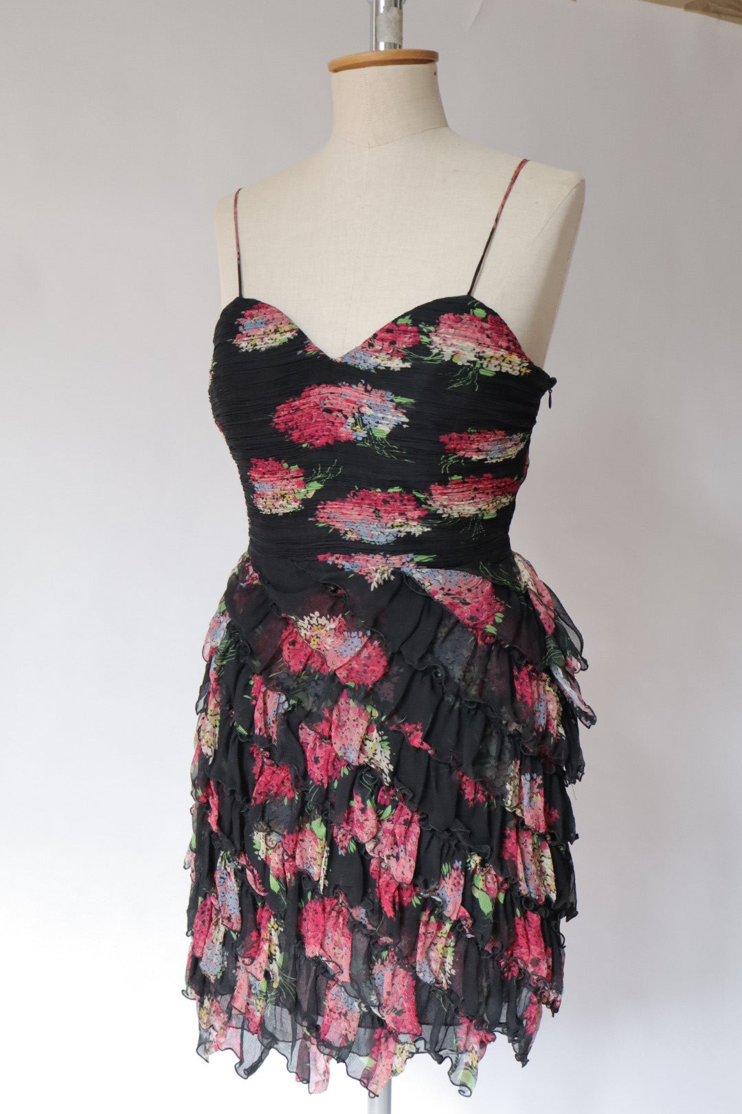 100% silk dress with flower print and ruffles. Size M