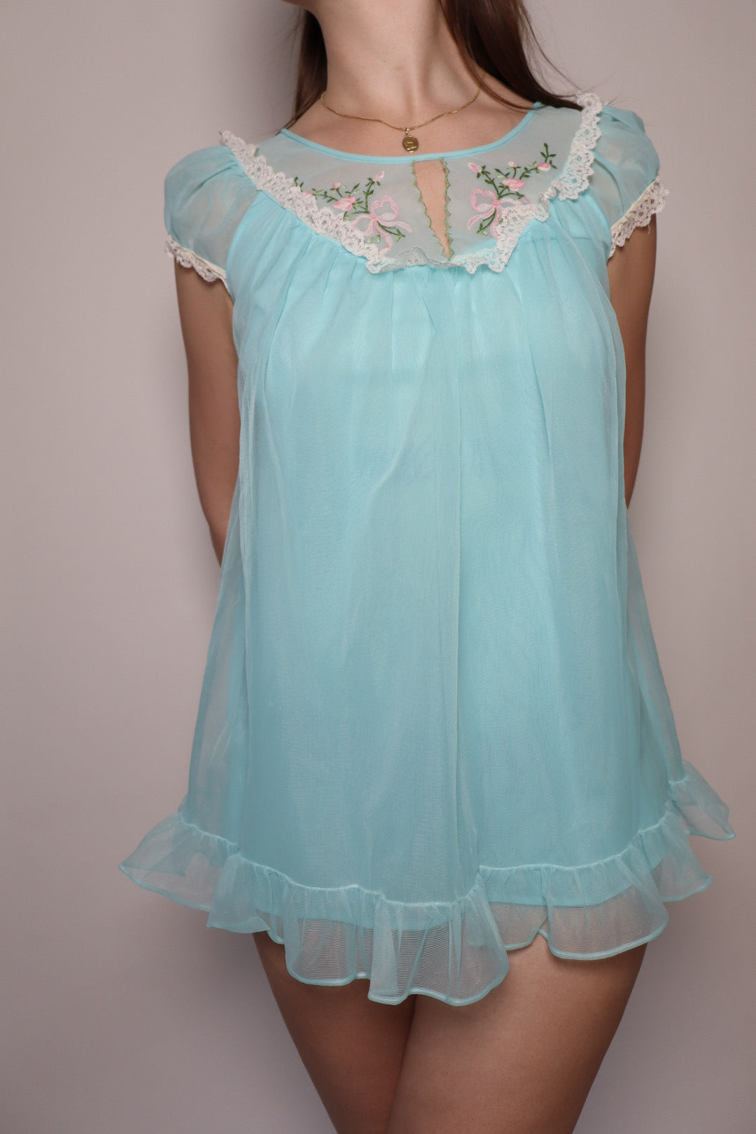 1960’s soft blue babydoll size small with embroidered bow & flower detail