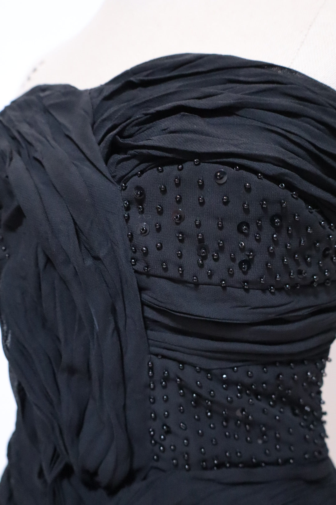 Black bustier top with pleads and beads, size L