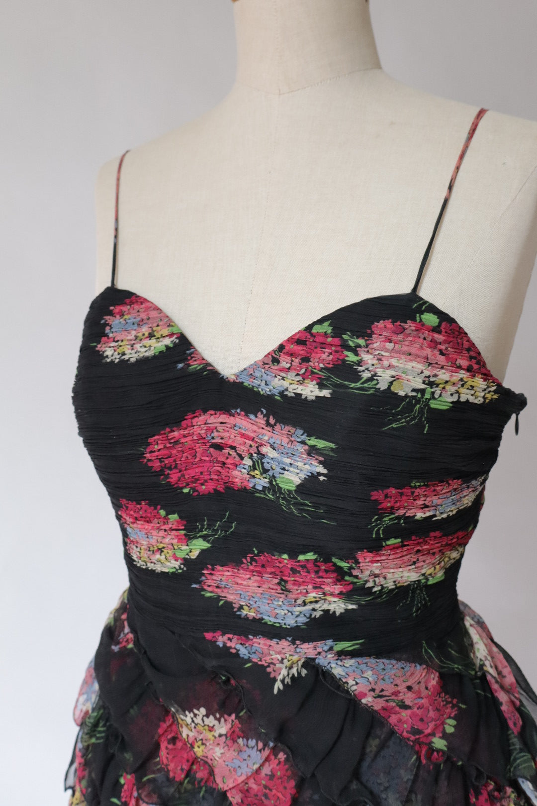 100% silk dress with flower print and ruffles. Size M