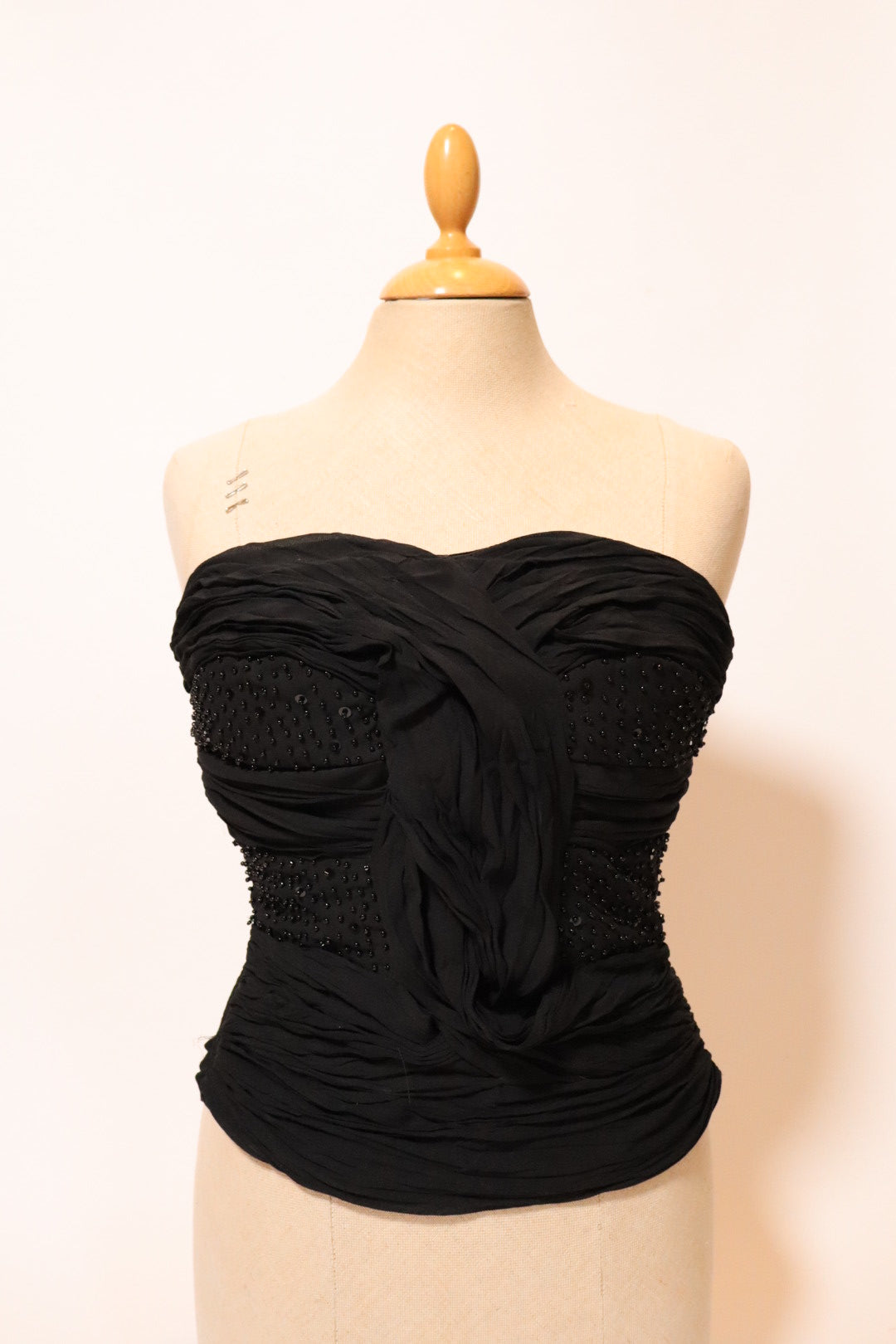 Black bustier top with pleads and beads, size L
