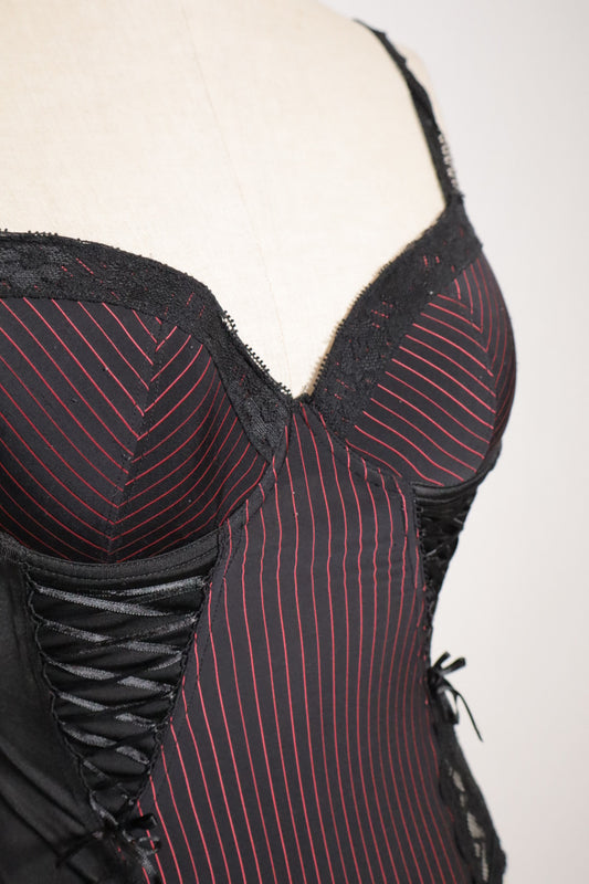Black bustier with red stripes, open back and corset details on the sides