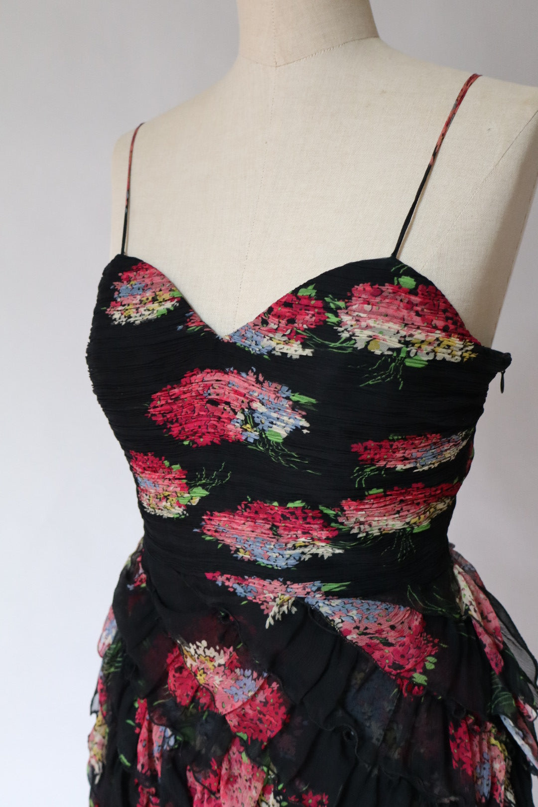 100% silk dress with flower print and ruffles. Size M