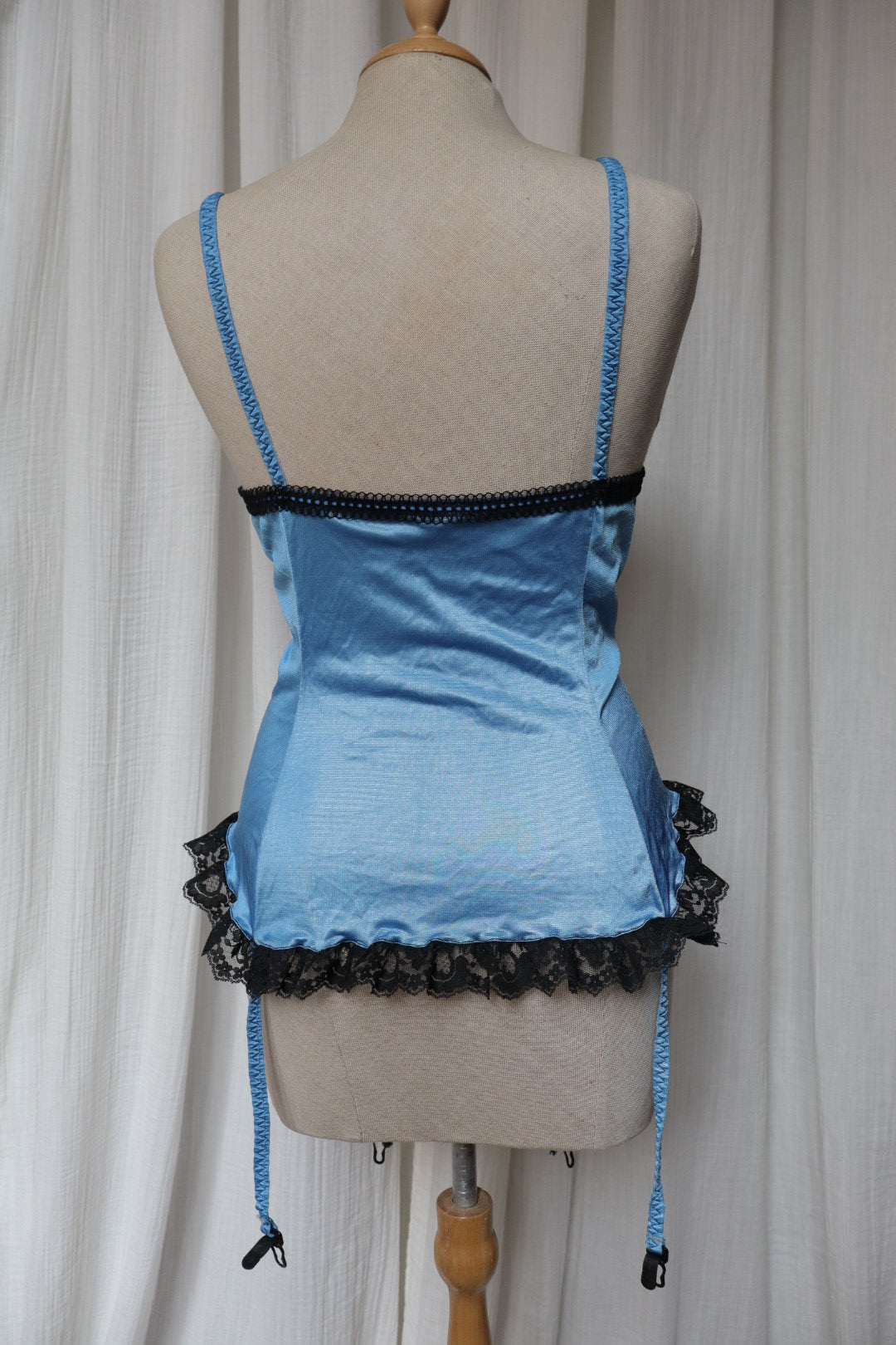 1980’s blue bustier top with black lace, size M (Made in USA)